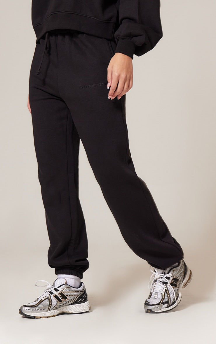 Pantalón Buzo Negro Mujer con Puño