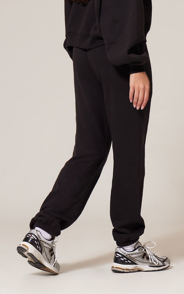 Pantalón Buzo Negro Mujer con Puño