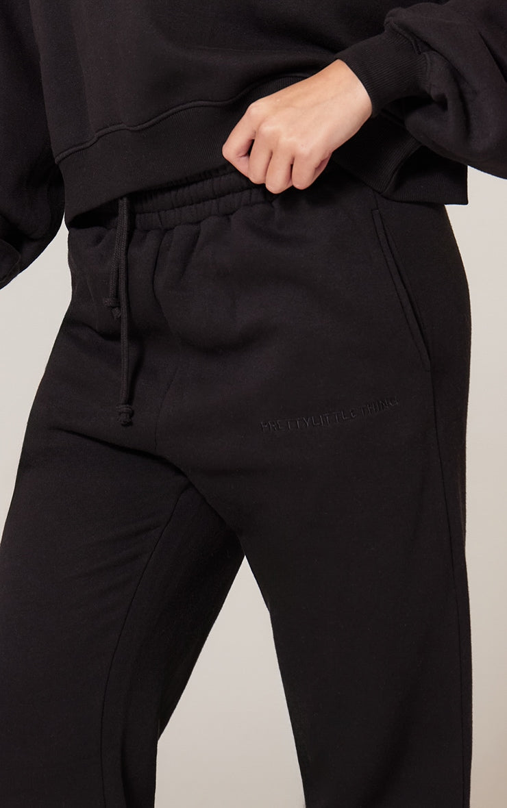 Pantalón Buzo Negro Mujer con Puño