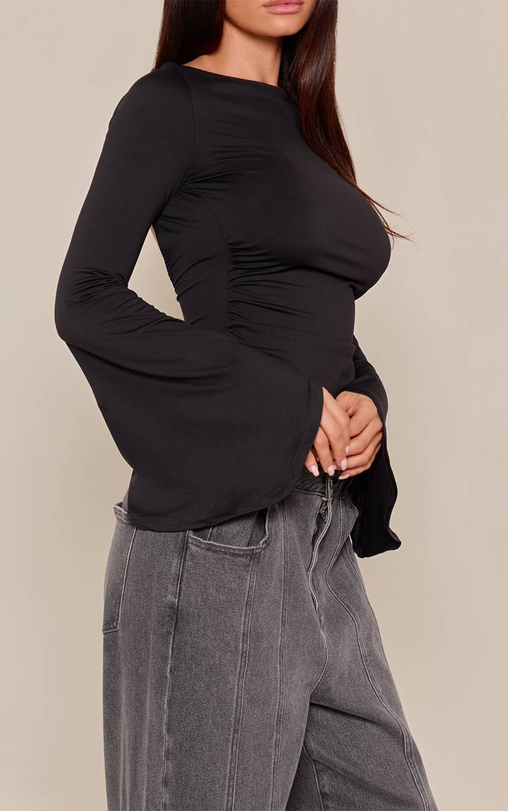 Camiseta Negra Mangas Flare VELT